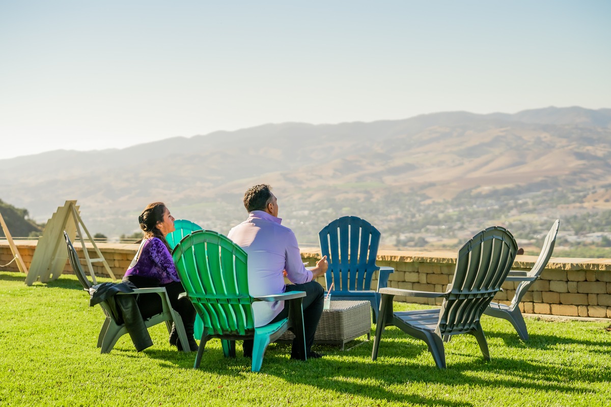 Guests overlooking the Central Coast hills at golden hour